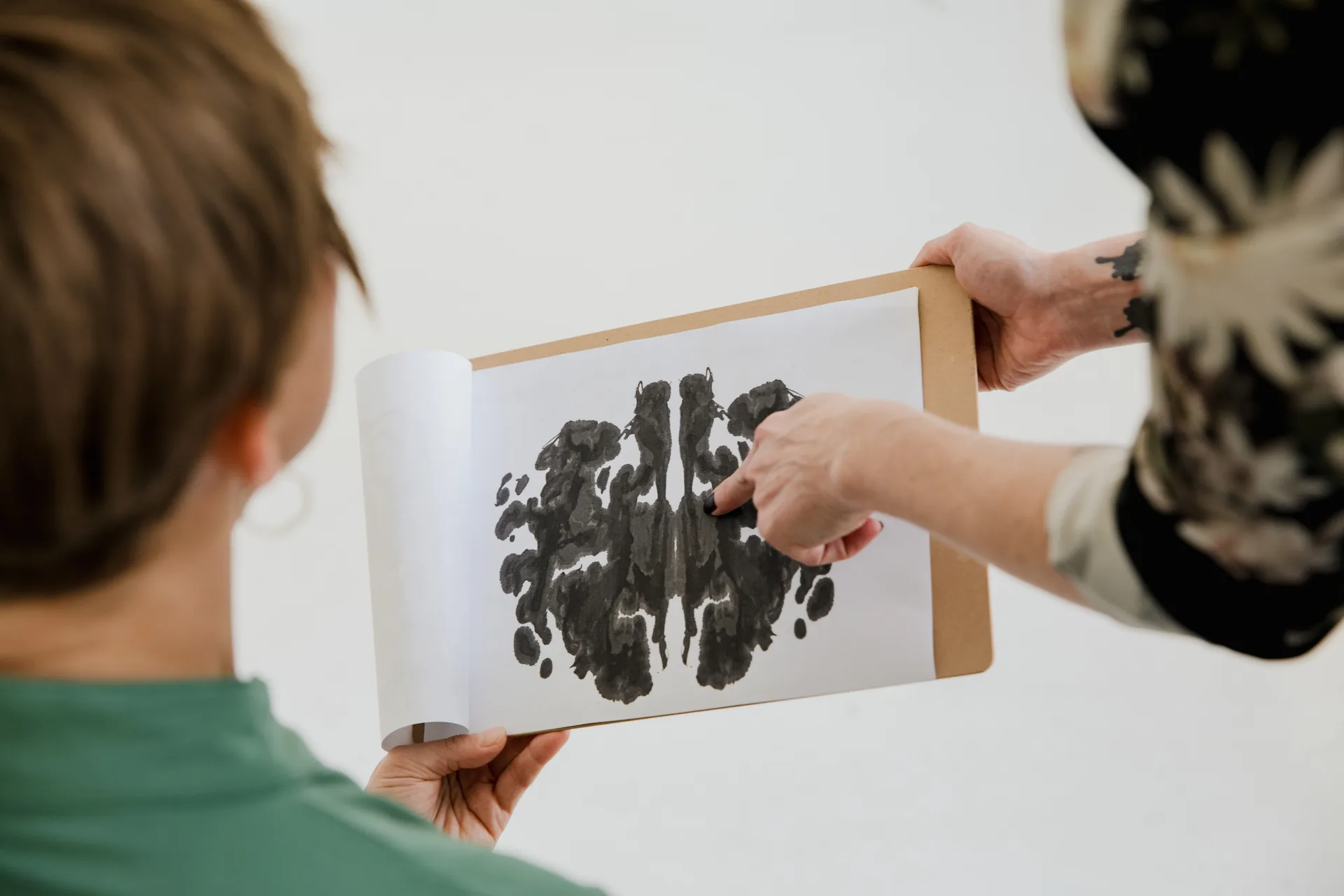 Psychologist and patient reviewing a Rorschach test during a neuropsychological assessment