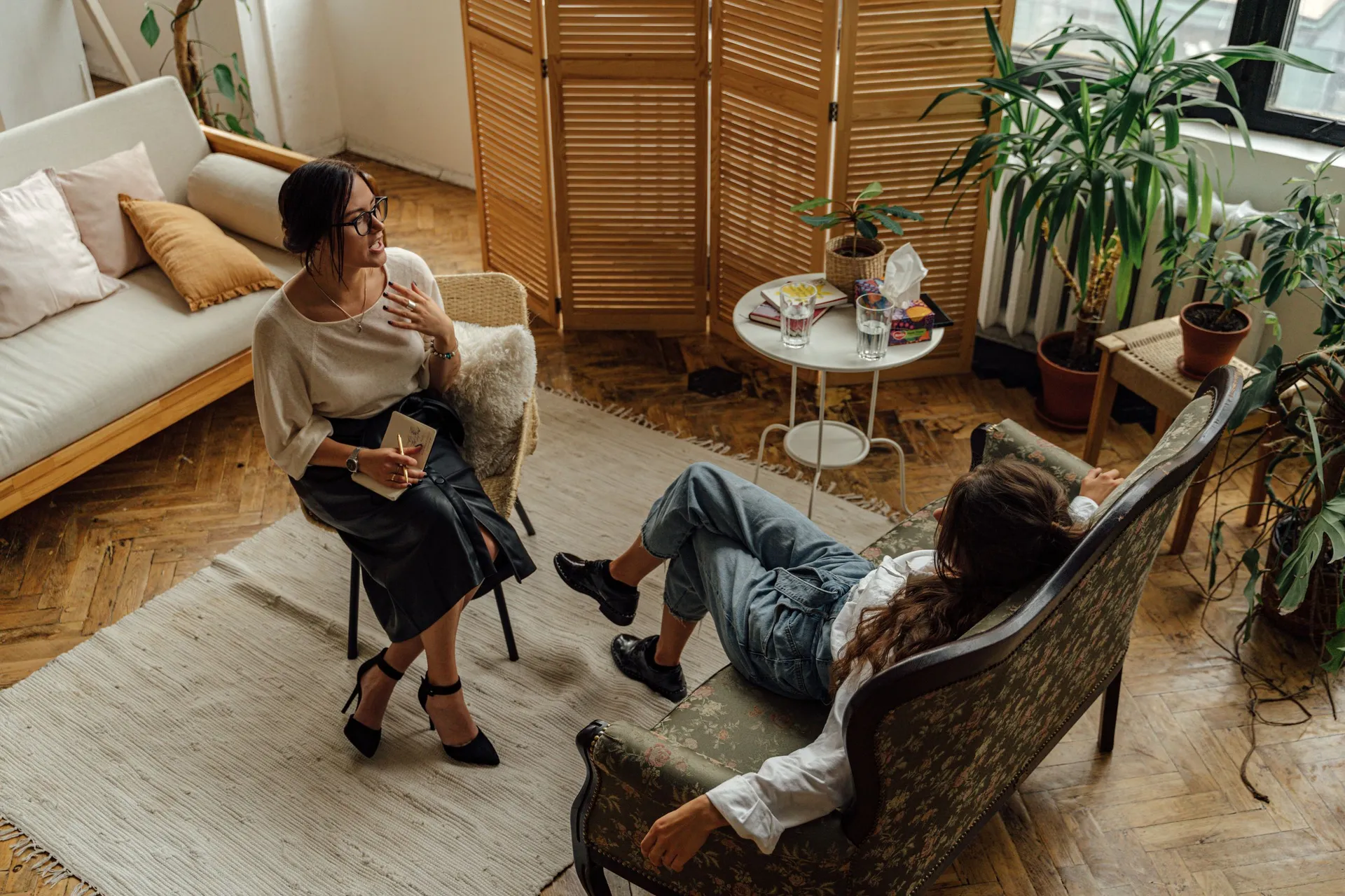 Woman in an individual therapy session sitting in an armchair in the office